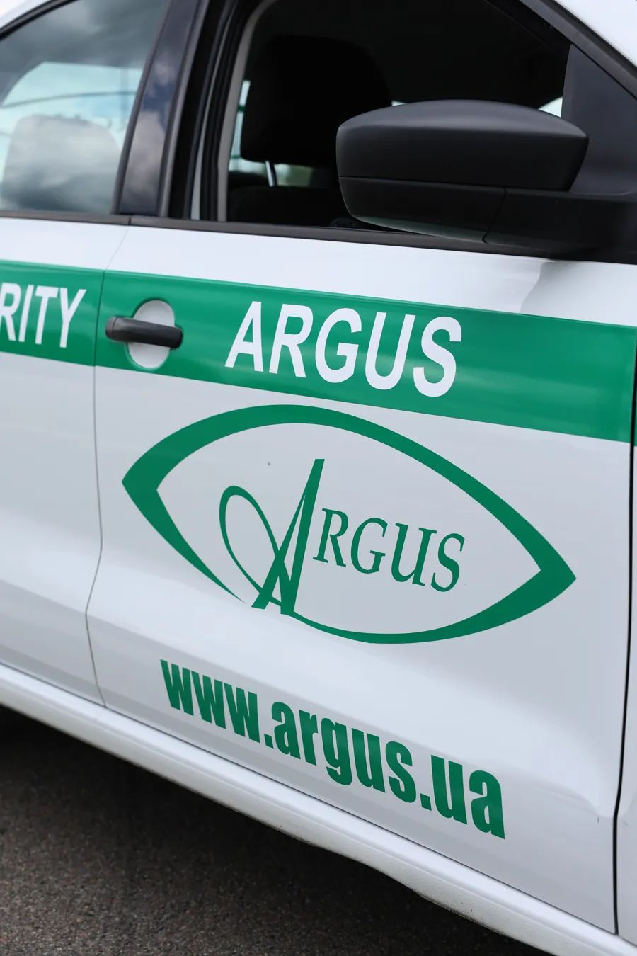 ARGUS Security branding and logo on the door of a company vehicle