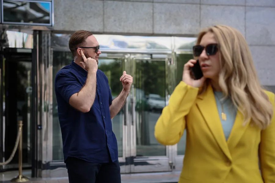 ARGUS close protection officer escorting a client at a building entrance