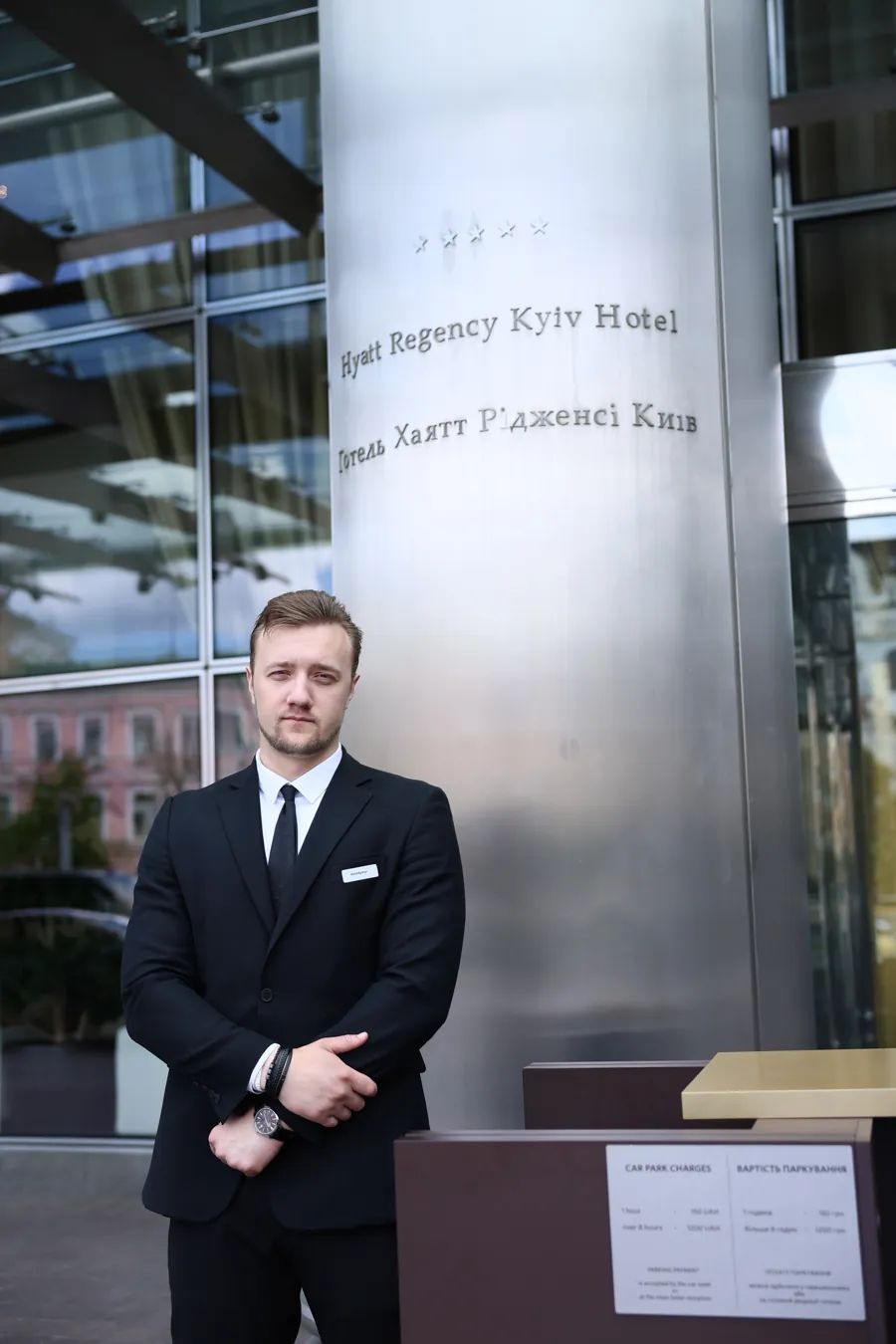 ARGUS security officer in a suit at the entrance of Hyatt Regency Kyiv