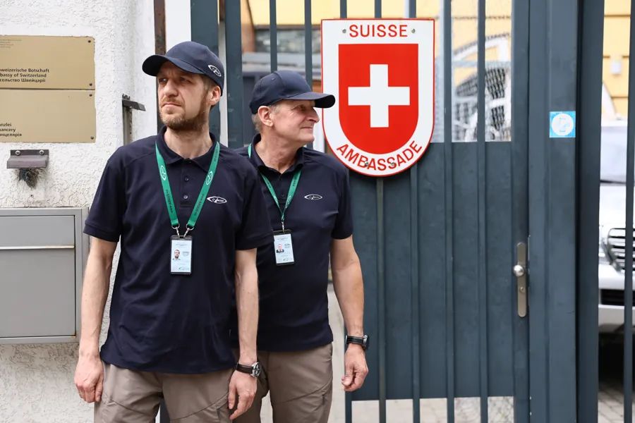 Two ARGUS guards at the entrance of the Embassy of Switzerland in Kyiv
